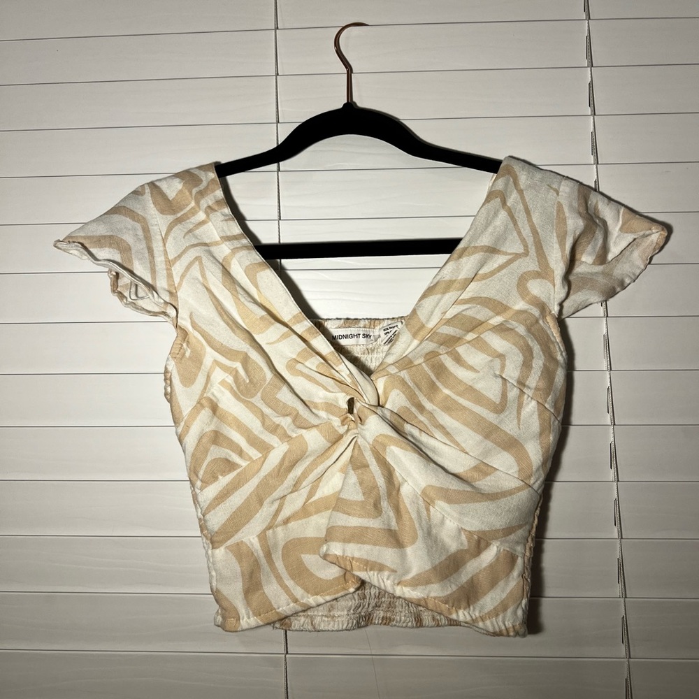 white and cream print shirt